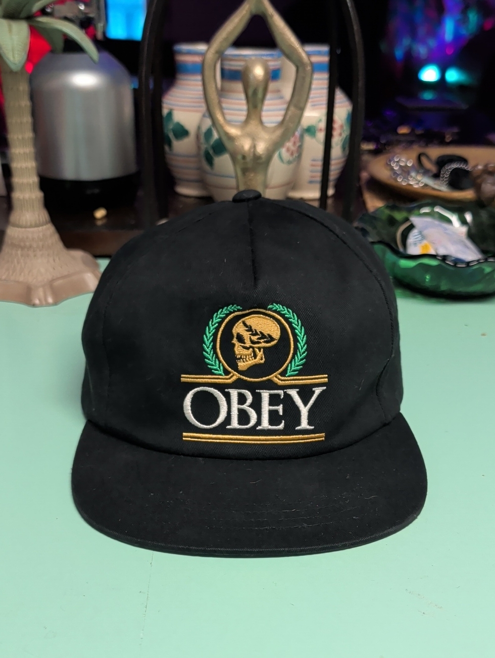 Obey Black Cap with Gold and Green Embroidered Crest